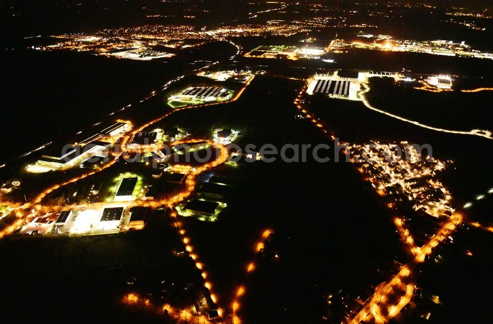 Ludwigsfelde at night from the bird perspective: Night lighting industrial estate and company settlement Brandenburg Park in Ludwigsfelde in the state Brandenburg, Germany