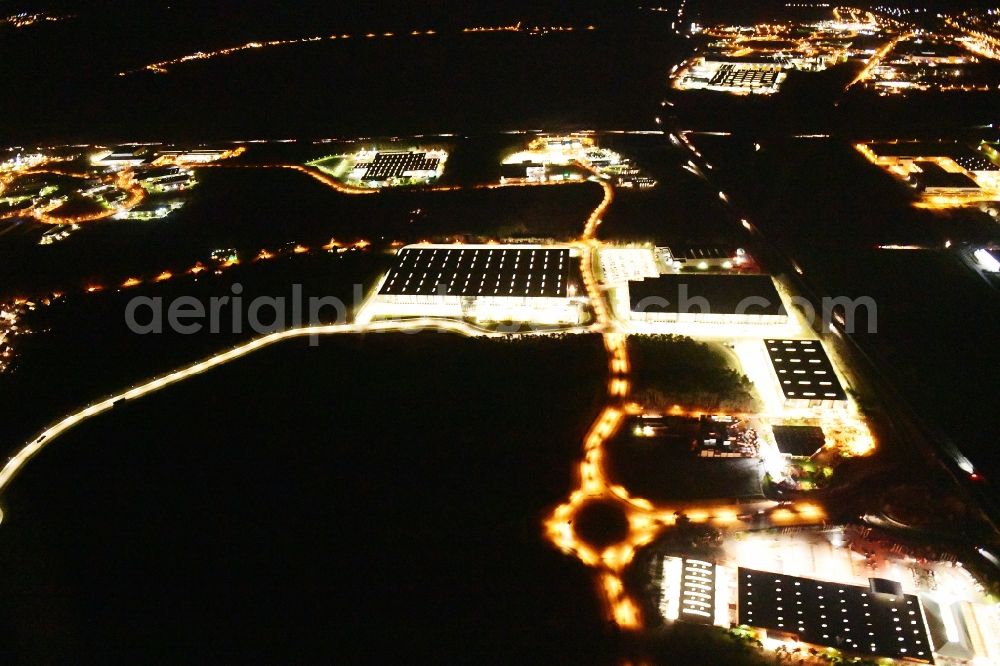 Aerial image at night Ludwigsfelde - Night lighting industrial estate and company settlement Brandenburg Park in Ludwigsfelde in the state Brandenburg, Germany