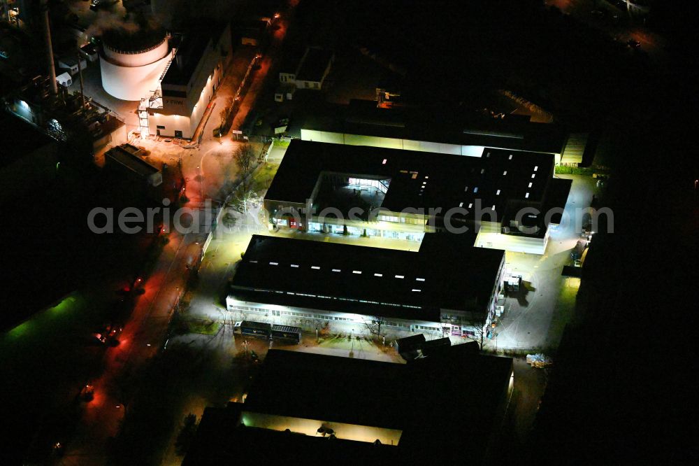 Aerial image at night Berlin - Night lighting industrial estate and company settlement on street Ederstrasse in the district Neukoelln in Berlin, Germany