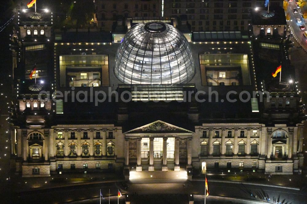Aerial photograph at night Berlin - Night lighting Glass dome on the roof of Reichstag in Berlin on the Spree sheets in Berlin - Mitte