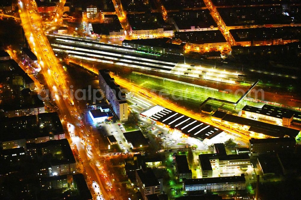 Aerial photograph at night Berlin - Night lighting Railway tracks and platforms of the station Lichtenberg in Berlin