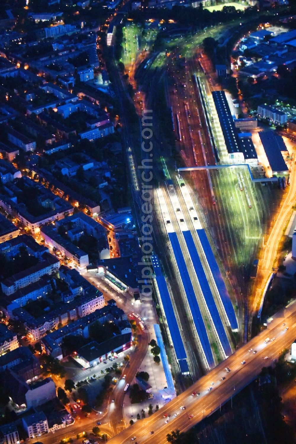 Aerial photograph at night Berlin - Night lighting Railway tracks and platforms of the station Lichtenberg in Berlin