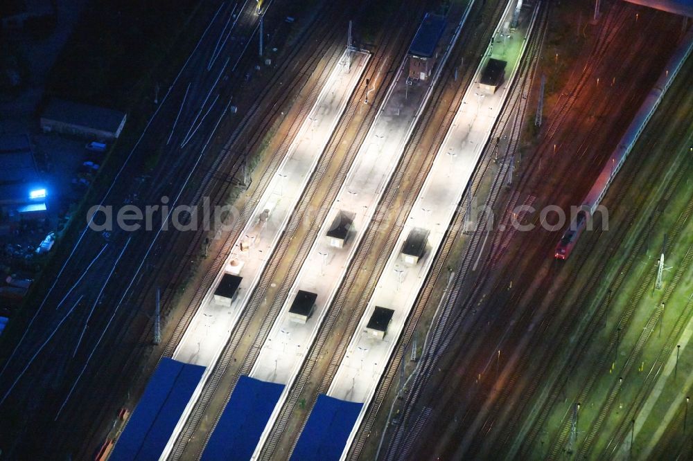 Berlin at night from the bird perspective: Night lighting Railway tracks and platforms of the station Lichtenberg in Berlin