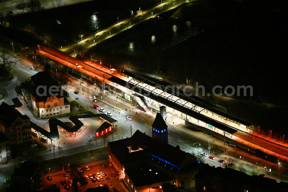Aerial image at night Jena - Night lighting station railway building of the Deutsche Bahn Paradiesbahnhof in Jena in the state Thuringia, Germany