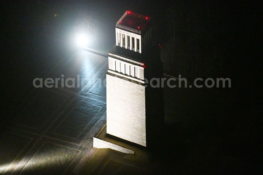 Weimar at night from the bird perspective: Night lighting tourist attraction of the historic monument Nationale Mahn- and Gedenkstaette of DDR Buchenwald in the district Ettersberg in Weimar in the state Thuringia, Germany