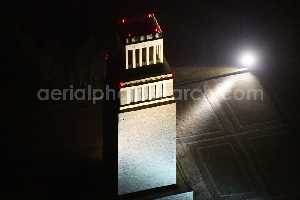 Aerial image at night Weimar - Night lighting tourist attraction of the historic monument Nationale Mahn- and Gedenkstaette of DDR Buchenwald in the district Ettersberg in Weimar in the state Thuringia, Germany