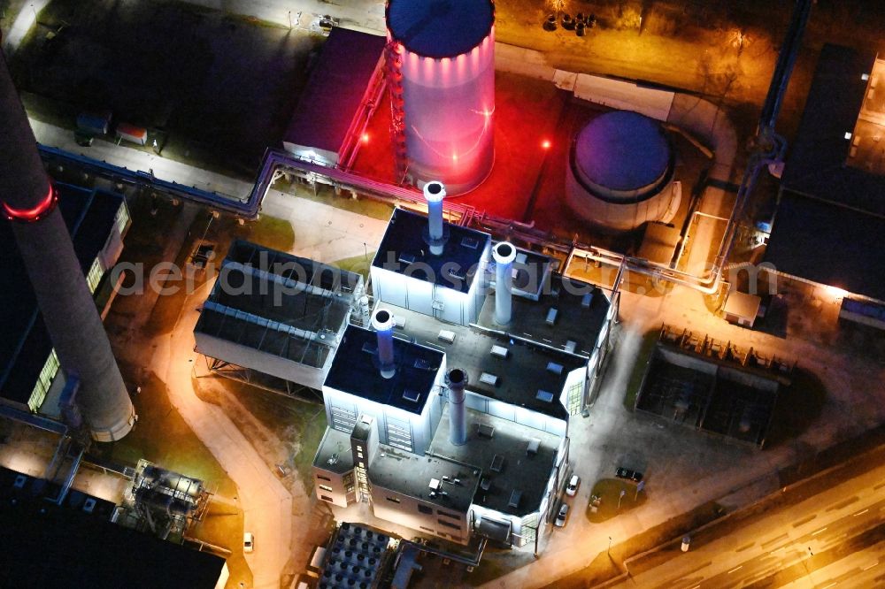 Schwerin at night from the bird perspective: Night lighting combined cycle power plant with gas and steam turbine systems on Pampower Strasse in the district Krebsfoerden in Schwerin in the state Mecklenburg - Western Pomerania, Germany