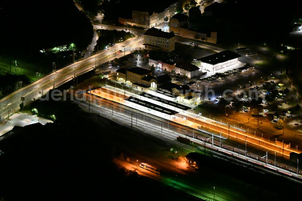 Aerial image at night Eberswalde - Night lighting Track progress and building of the main station of the railway on street Bahnhofsring in Eberswalde in the state Brandenburg, Germany