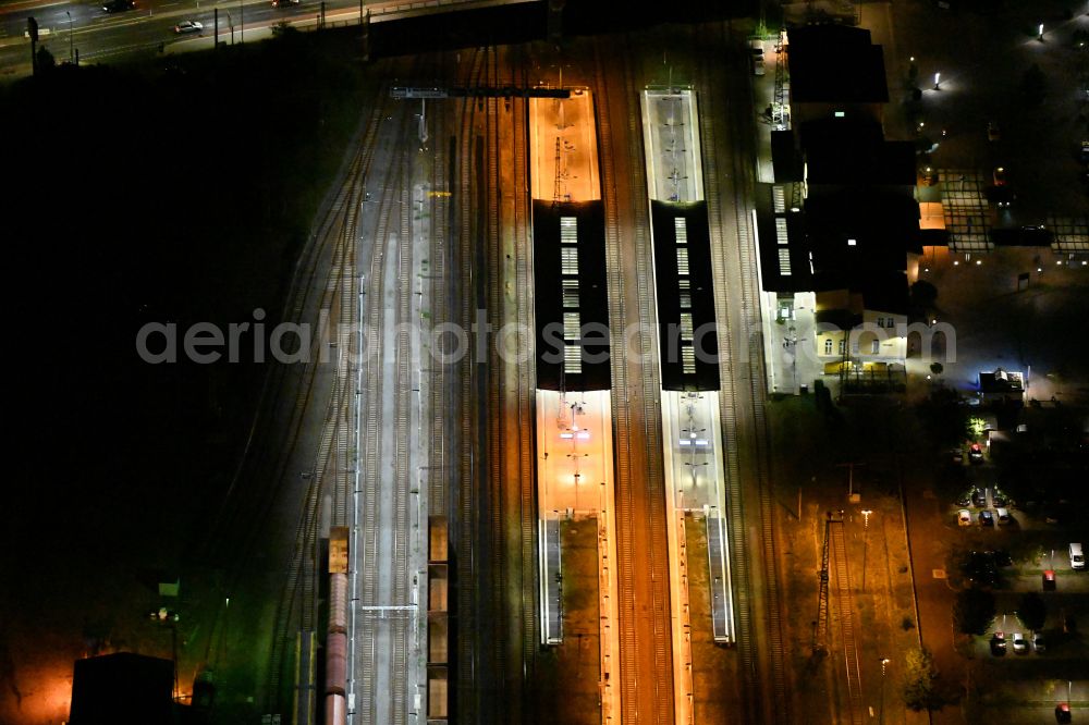 Aerial photograph at night Eberswalde - Night lighting Track progress and building of the main station of the railway on street Bahnhofsring in Eberswalde in the state Brandenburg, Germany