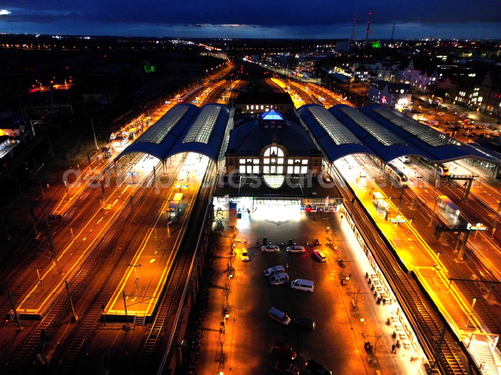 Halle (Saale) at night from above - Night lighting track progress and building of the main station of the railway in Halle (Saale) in the state Saxony-Anhalt, Germany