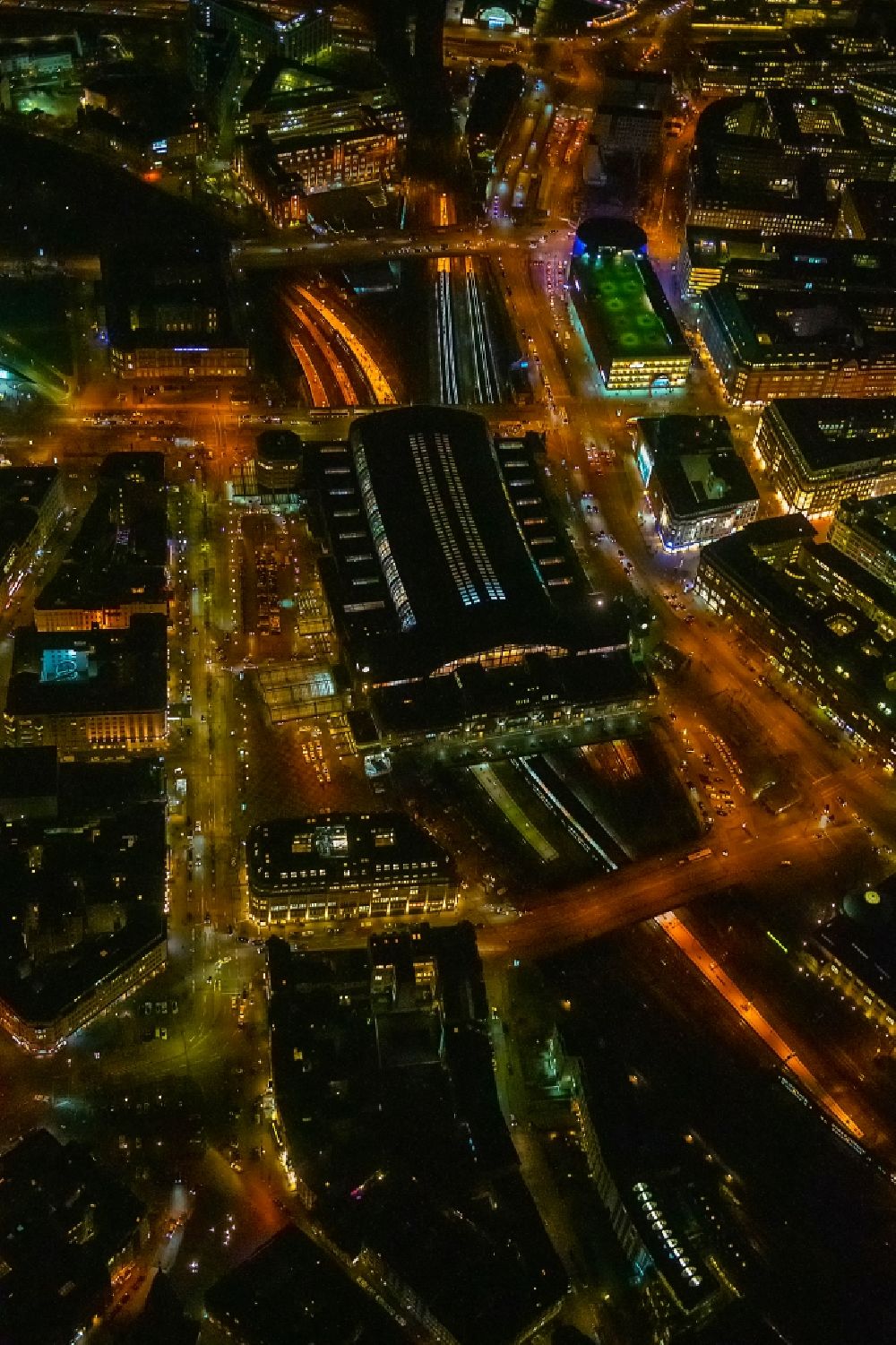 Aerial photograph at night Hamburg - Night lighting track progress and building of the main station of the railway in Hamburg, Germany