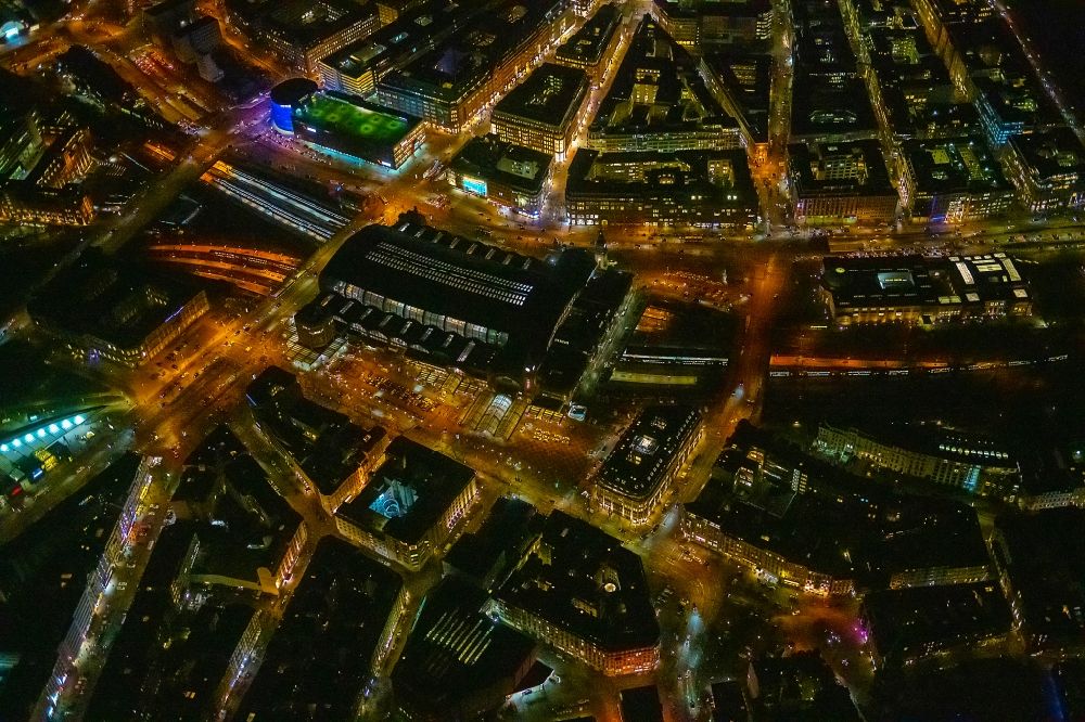 Aerial image at night Hamburg - Night lighting track progress and building of the main station of the railway in Hamburg, Germany