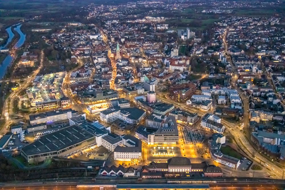 Aerial photograph at night Hamm - Night lighting city center on track progress and building of the main station of the railway in Hamm in the state North Rhine-Westphalia, Germany