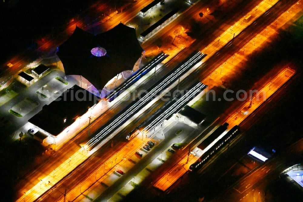 Lutherstadt Wittenberg at night from above - Night lighting track progress and building of the main station of the railway in Lutherstadt Wittenberg in the state Saxony-Anhalt, Germany