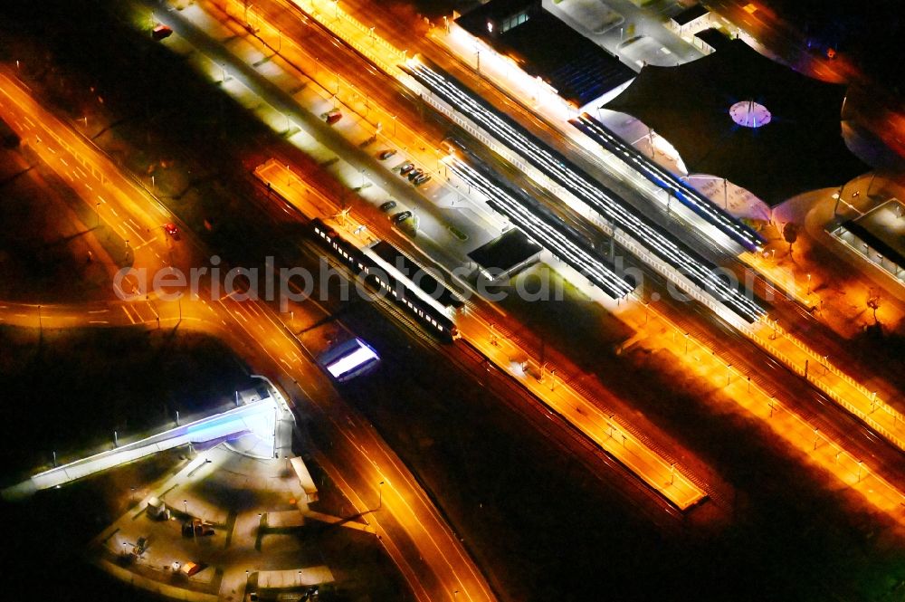 Aerial photograph at night Lutherstadt Wittenberg - Night lighting track progress and building of the main station of the railway in Lutherstadt Wittenberg in the state Saxony-Anhalt, Germany