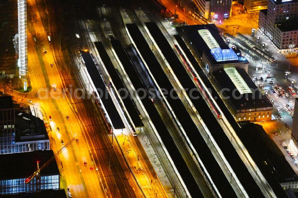 Aerial image at night Mannheim - Night lighting track progress and building of the main station of the railway in Mannheim in the state Baden-Wurttemberg, Germany