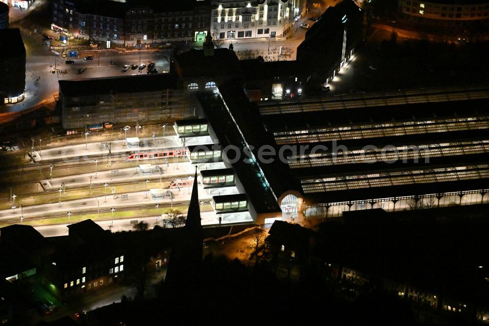 Aerial image at night Lübeck - Night lighting main station of the railway in the district Sankt Lorenz Sued in Luebeck in the state Schleswig-Holstein