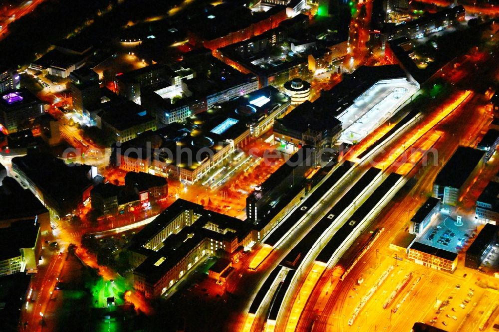 Aerial image at night Saarbrücken - Night lighting track progress and building of the main station of the railway in Saarbruecken in the state Saarland, Germany