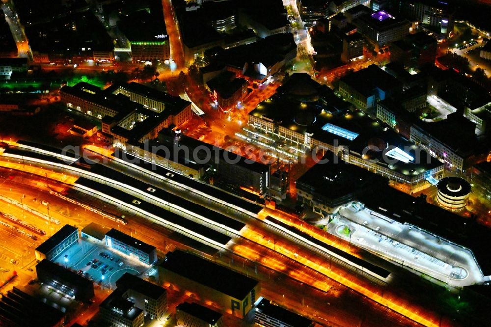 Aerial image at night Saarbrücken - Night lighting track progress and building of the main station of the railway in Saarbruecken in the state Saarland, Germany