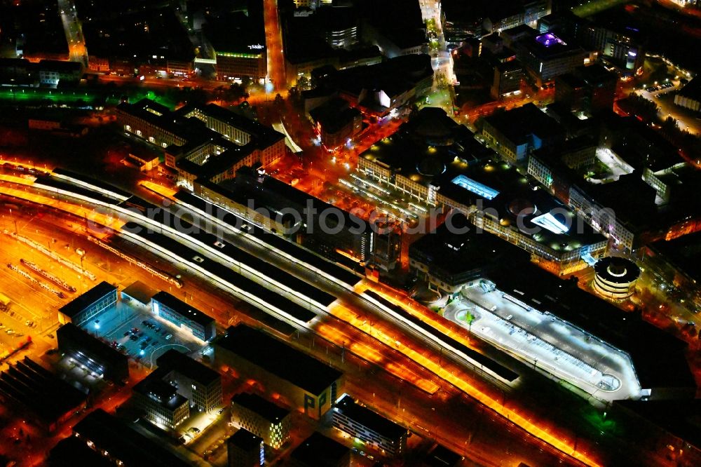 Saarbrücken at night from above - Night lighting track progress and building of the main station of the railway in Saarbruecken in the state Saarland, Germany