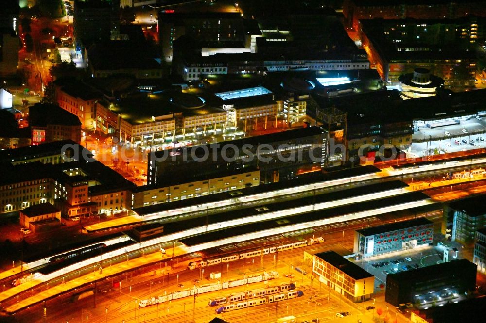 Saarbrücken at night from the bird perspective: Night lighting track progress and building of the main station of the railway in Saarbruecken in the state Saarland, Germany