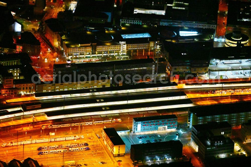 Aerial photograph at night Saarbrücken - Night lighting track progress and building of the main station of the railway in Saarbruecken in the state Saarland, Germany