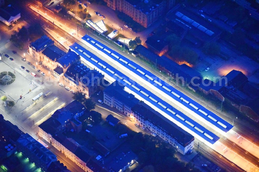 Aerial image at night Schwerin - Night lighting Track progress and building of the main station of the railway in Schwerin in the state Mecklenburg - Western Pomerania, Germany