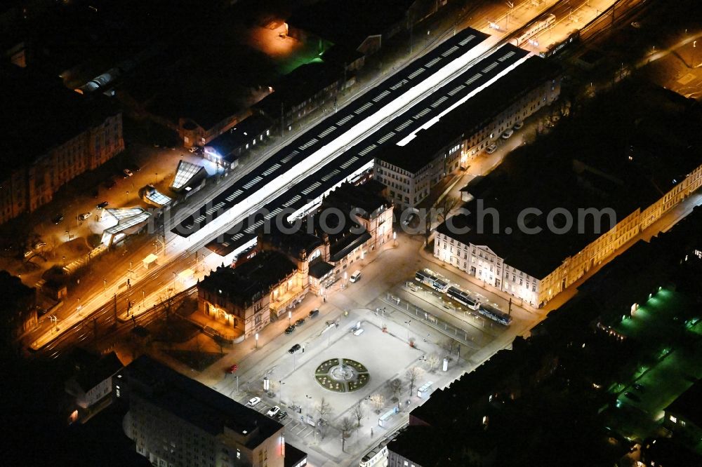 Schwerin at night from above - Night lighting track progress and building of the main station of the railway in Schwerin in the state Mecklenburg - Western Pomerania, Germany
