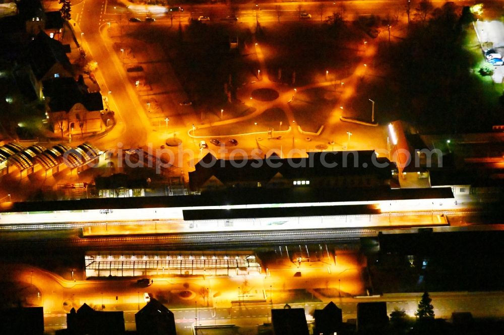 Wernigerode at night from above - Night lighting track progress and building of the main station of the railway in Wernigerode in the state Saxony-Anhalt, Germany