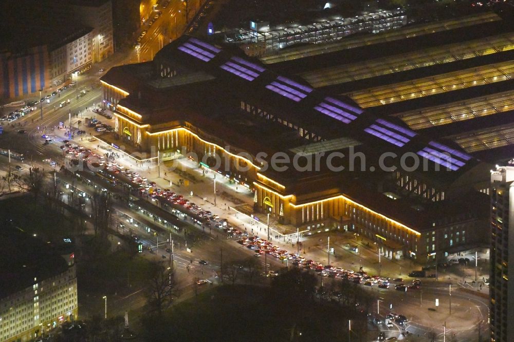 Aerial photograph at night Leipzig - Night lighting view over the building of the main station in Leipzig in Saxony