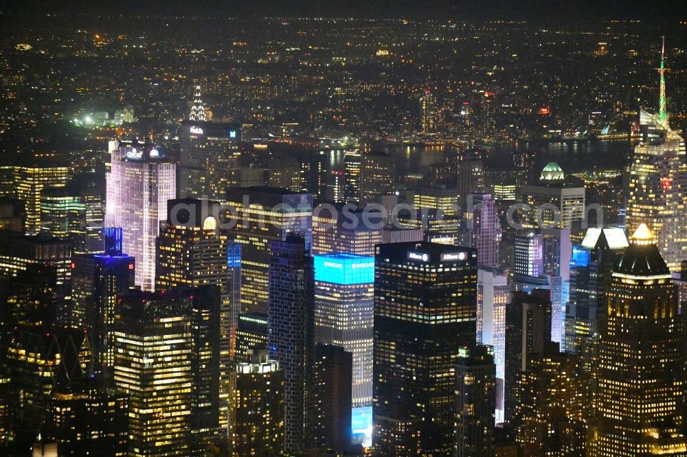 New York at night from the bird perspective: Night lighting High-rise ensemble in the district Manhattan in New York in United States of America