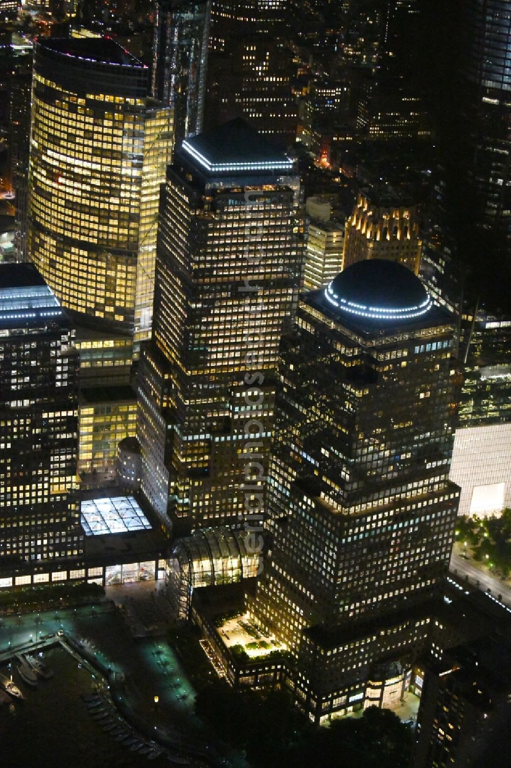New York at night from the bird perspective: Night lighting High-rise ensemble of West St - Brookfield Place in the district Manhattan in New York in United States of America