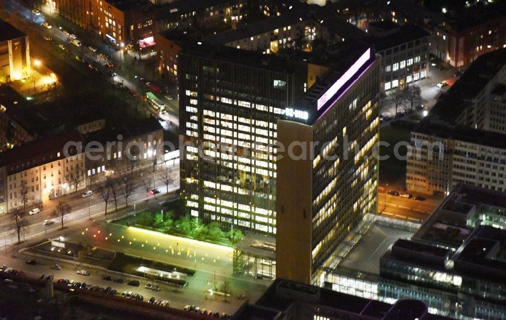 Berlin at night from the bird perspective: Night lighting Office and corporate management high-rise building of Axel-Springer Verlages on street Rudi- Dutschke- Strasse - Axel- Springer- Strasse in the district Kreuzberg in Berlin, Germany