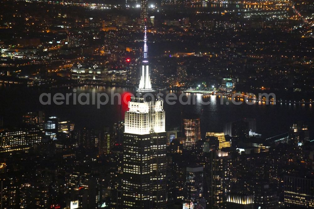 Aerial photograph at night New York - Night lighting High-rise buildings Empire State Building on 350 5th Ave in the district Manhattan in New York in United States of America