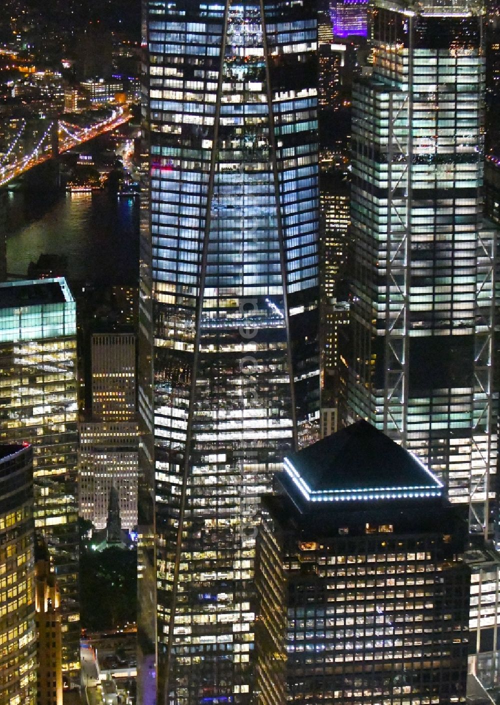 Aerial photograph at night New York - Night lighting High-rise buildings One World Trade Center in the district Manhattan in New York in United States of America