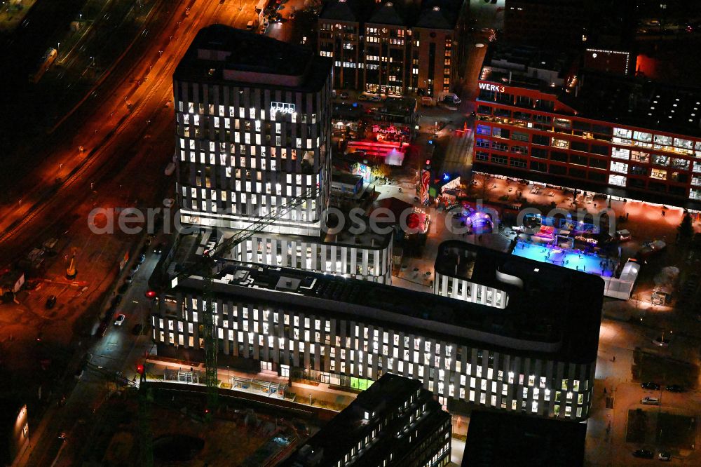 München at night from above - Night lighting high-rise building complex on Friedenstrasse in Werksviertel in the district Berg am Laim in Munich in the state Bavaria, Germany