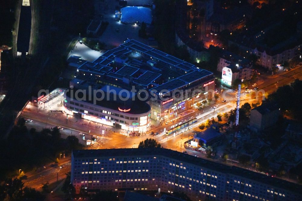 Aerial image at night Berlin - Night lighting building of the shopping center Ring Center 2 Am Containerbahnhof in the district Lichtenberg in Berlin, Germany. Up to date, previously unused parking deck of a new built hotel with SKYPARK hotel room modules
