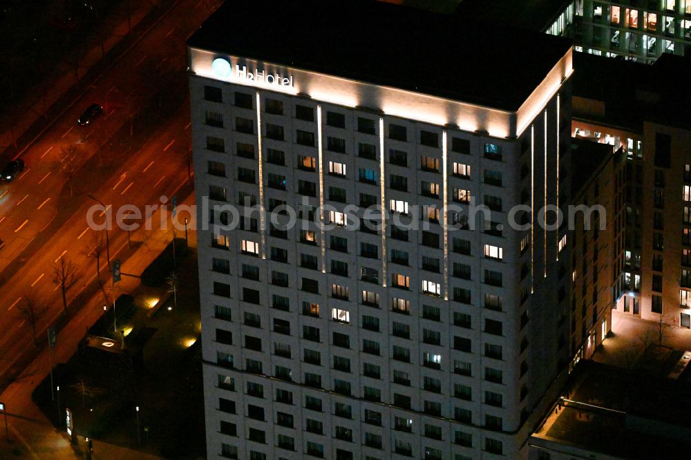 Aerial image at night München - Night lighting hotel complex H2 Hotel Muenchen Olympiapark on Moosacher Strasse in the district Milbertshofen-Am Hart in Munich in the state Bavaria, Germany