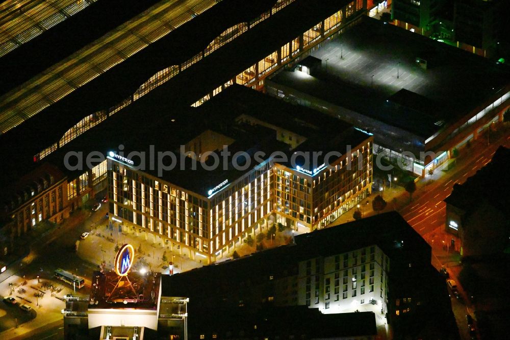 Aerial image at night Leipzig - Night lighting hotel complex of H-Hotels AG in Leipzig in the state Saxony, Germany