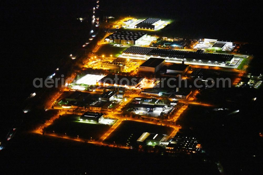 Radeburg at night from above - Night lighting industrial and commercial area Zum Wertfeld in the district Berbisdorf in Radeburg in the state Saxony, Germany