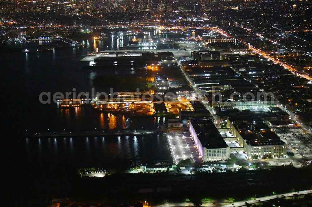New York at night from the bird perspective: Night lighting Industrial and commercial area Brooklyn Army Terminal on 58th St in the district Brooklyn in New York in United States of America