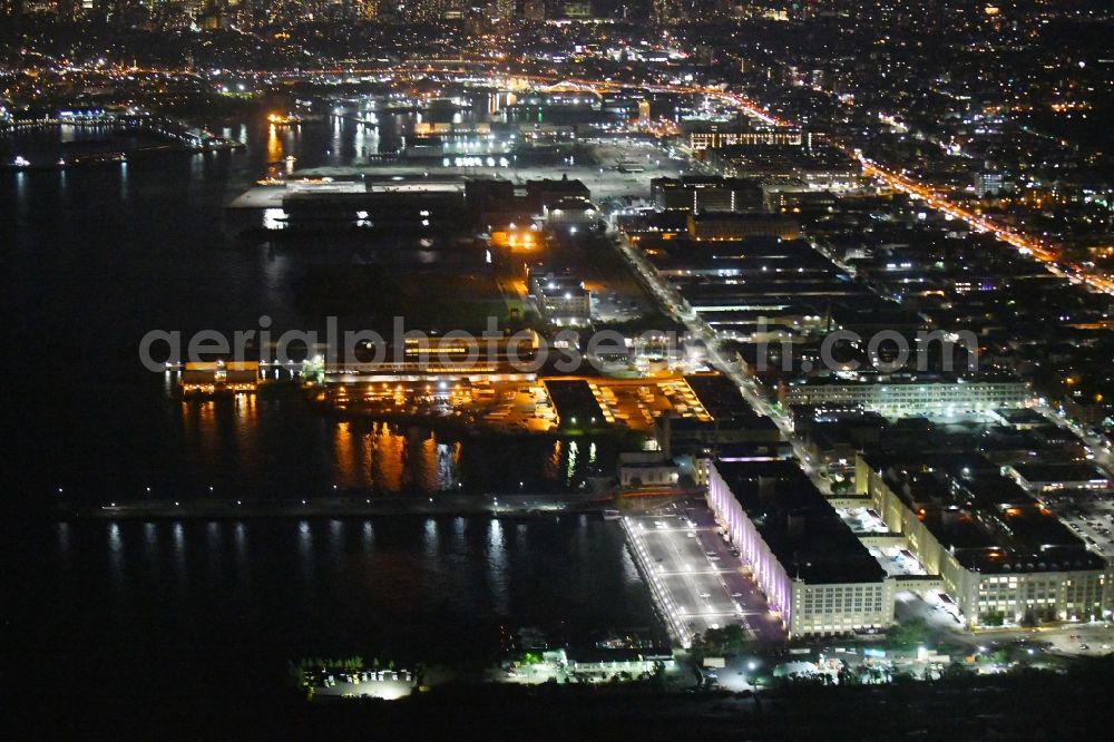 Aerial image at night New York - Night lighting Industrial and commercial area Brooklyn Army Terminal on 58th St in the district Brooklyn in New York in United States of America