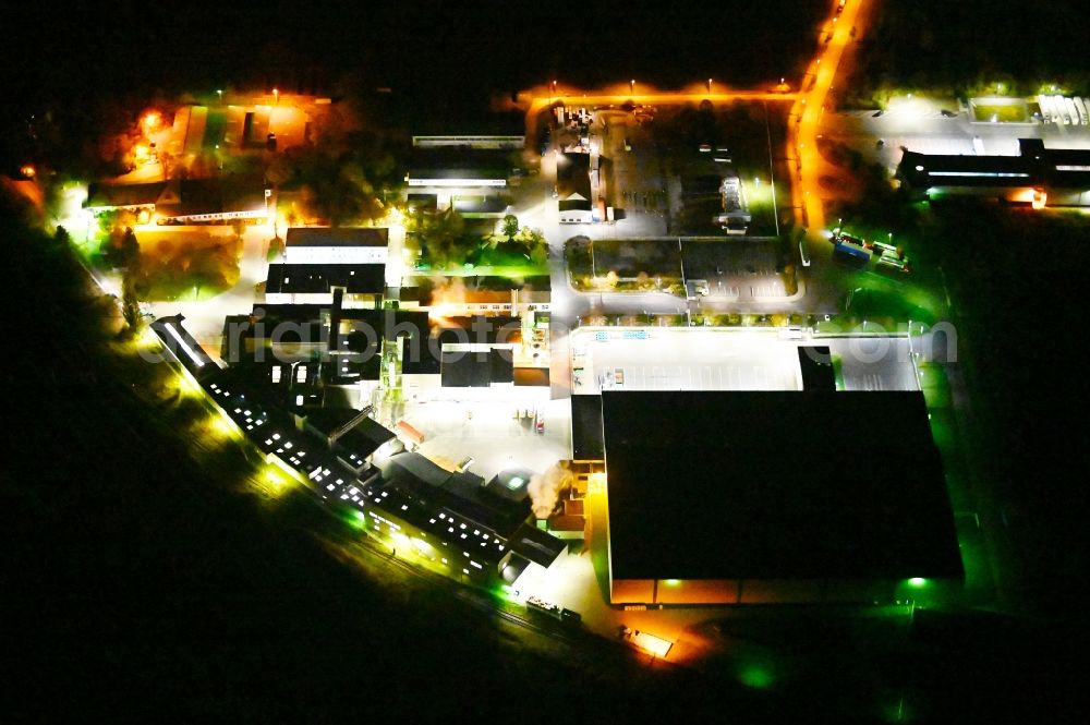 Aerial photograph at night Lutherstadt Wittenberg - Night lighting industrial and commercial area along the Thedinghauser Strasse in the district Pratau in Lutherstadt Wittenberg in the state Saxony-Anhalt, Germany