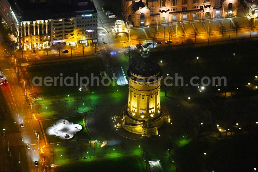 Mannheim at night from above - Night lighting building of industrial monument water tower Mannheimer Wasserturm on place Friedrichsplatz in the district Quadrate in Mannheim in the state Baden-Wurttemberg, Germany