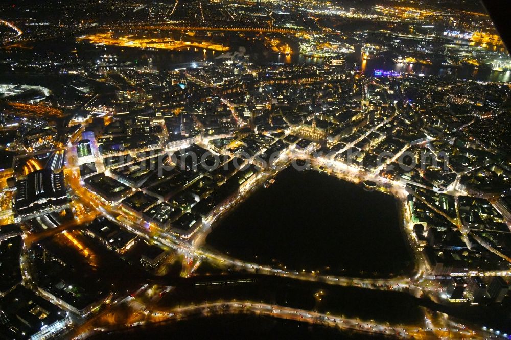 Hamburg at night from the bird perspective: Night lighting city view of the downtown area on the shore areas of Binnenalster in Hamburg, Germany