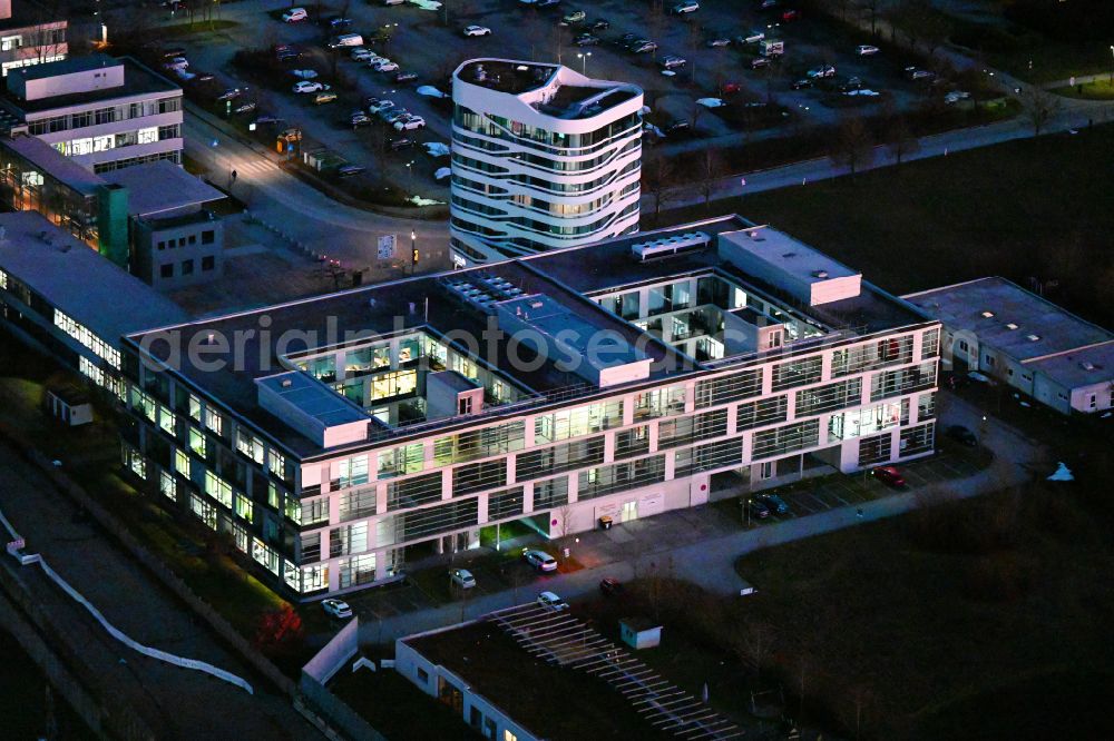München at night from the bird perspective: Night lighting research building and office complex IZB Innovations- und Gruenderzentrum Biotechnologie Am Klopferspitz in the district Hadern - Martinsried in Munich in the state Bavaria, Germany