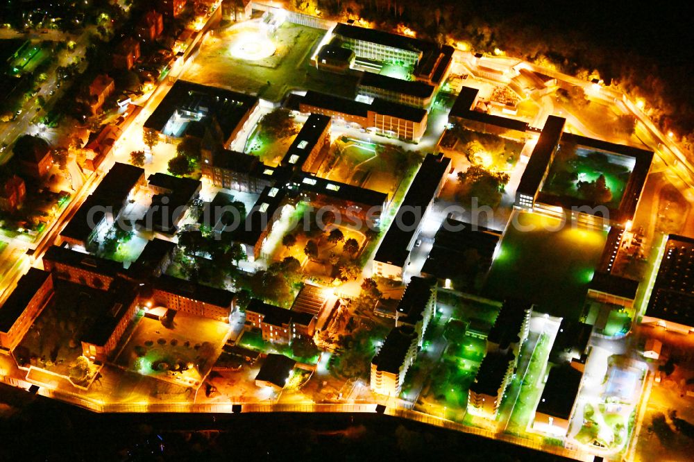 Berlin at night from the bird perspective: Night lighting prison grounds and high security fence Prison Tegel on Seidelstrasse in the district Reinickendorf in Berlin, Germany