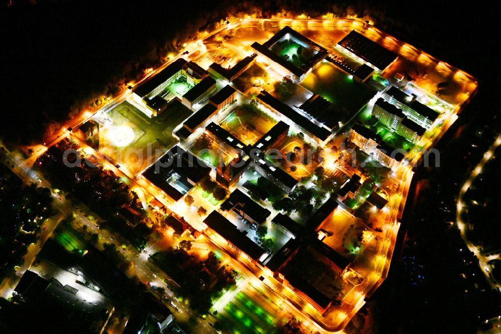Aerial image at night Berlin - Night lighting prison grounds and high security fence Prison Tegel on Seidelstrasse in the district Reinickendorf in Berlin, Germany