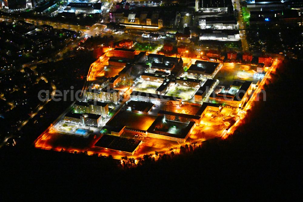 Berlin at night from the bird perspective: Night lighting prison grounds and high security fence Prison Tegel on Seidelstrasse in the district Reinickendorf in Berlin, Germany