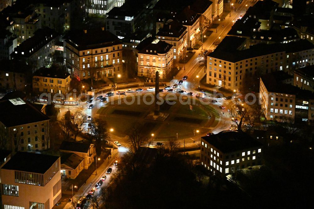 Aerial image at night München - Night lighting circular Place Karolinenplatz in Munich in the state Bavaria, Germany